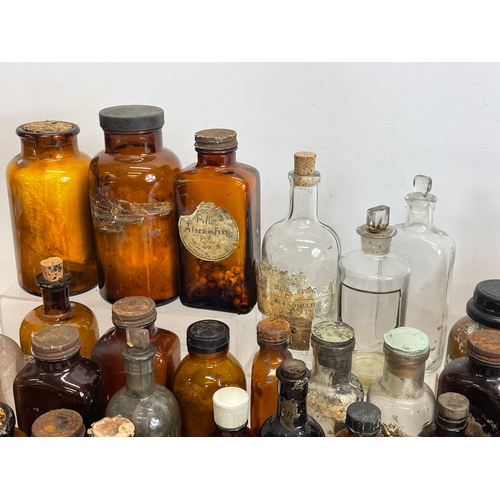 70 - A collection of vintage chemist bottles.