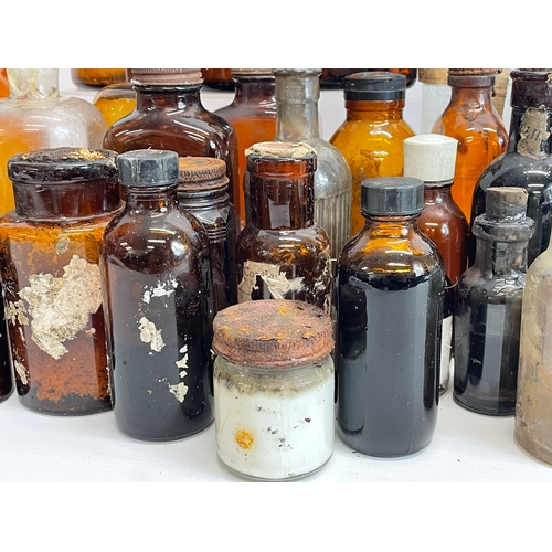 70 - A collection of vintage chemist bottles.