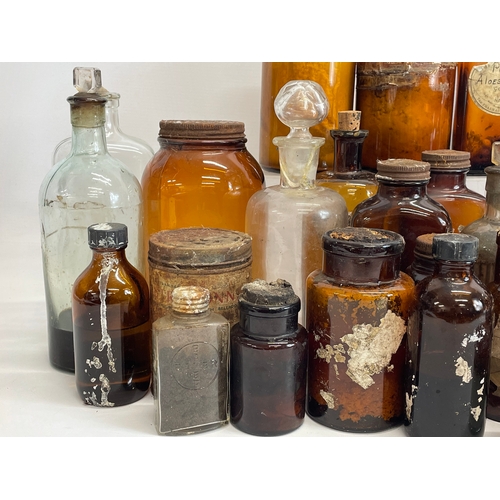 70 - A collection of vintage chemist bottles.