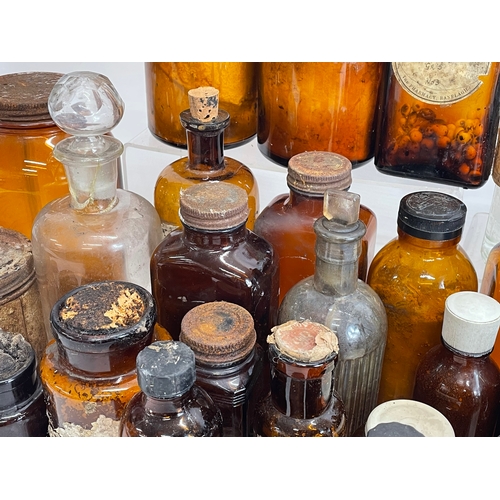 70 - A collection of vintage chemist bottles.