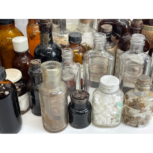 70 - A collection of vintage chemist bottles.