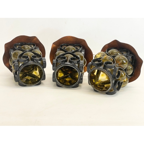 132 - A set of 3 vintage wrought iron bound Amber Bubble Glass light fittings. 19x26cm