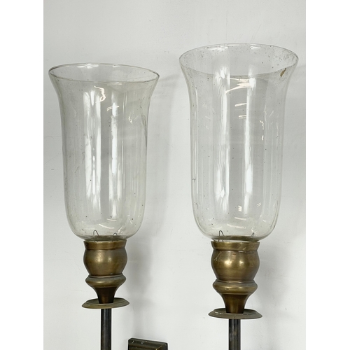 20 - A pair of large vintage heavy brass wall sconces with glass shades. 65cm