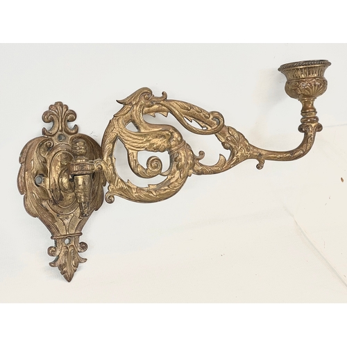 22 - A pair of early 20th century ornate brass wall sconces. 21cm