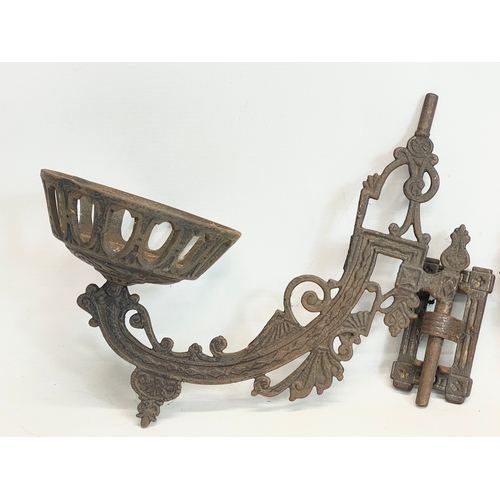 23 - A pair of vintage cast iron wall sconces. 29cm