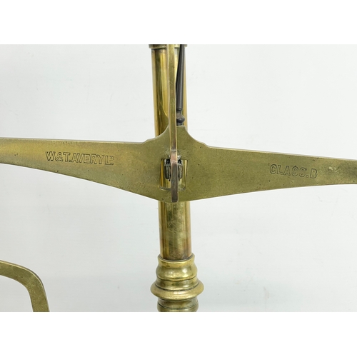 76 - A set of Edwardian W&T Avery LTD Class B brass balance scales with Avery weights. 51x28x58cm