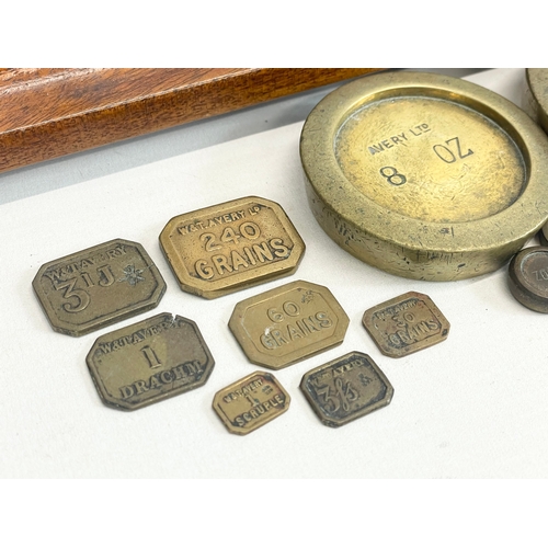 76 - A set of Edwardian W&T Avery LTD Class B brass balance scales with Avery weights. 51x28x58cm