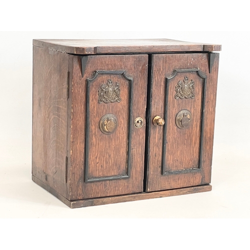 24 - A late Victorian oak table top cabinet with 3 interior drawers, in the style of a safe. By E.R. Moor... 