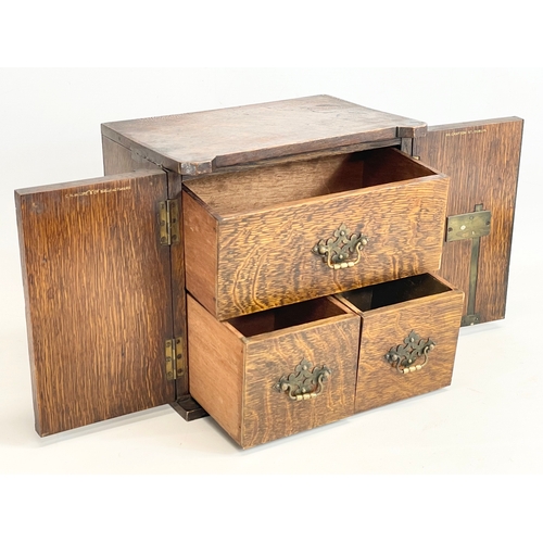 24 - A late Victorian oak table top cabinet with 3 interior drawers, in the style of a safe. By E.R. Moor... 