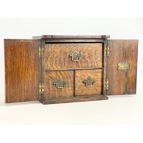 24 - A late Victorian oak table top cabinet with 3 interior drawers, in the style of a safe. By E.R. Moor... 