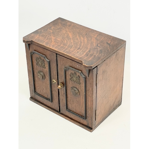 24 - A late Victorian oak table top cabinet with 3 interior drawers, in the style of a safe. By E.R. Moor... 