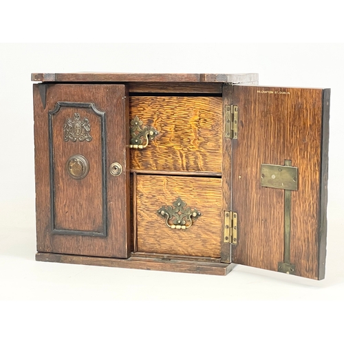 24 - A late Victorian oak table top cabinet with 3 interior drawers, in the style of a safe. By E.R. Moor... 