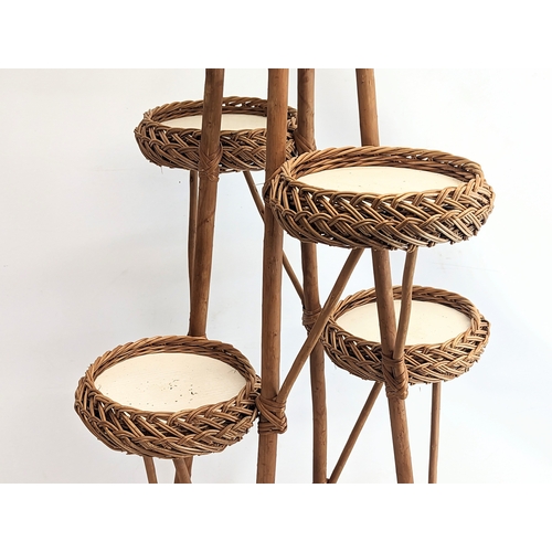 321 - A tall wicker plant stand. 113cm