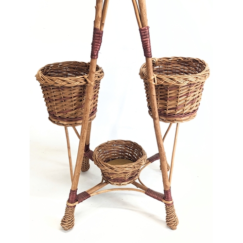 320 - A tall wicker plant stand. 96.5cm