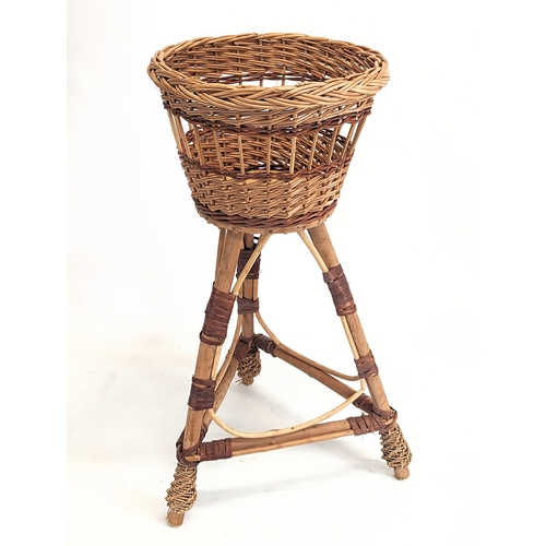 316 - A near pair of wicker plant stands. Tallest measures 56cm