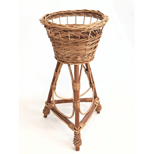 316 - A near pair of wicker plant stands. Tallest measures 56cm