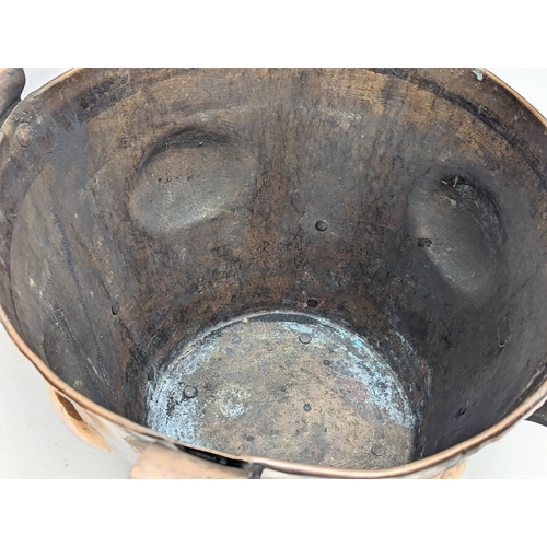 28 - A late 19th century Art Nouveau copper coal bucket. 52x42cm