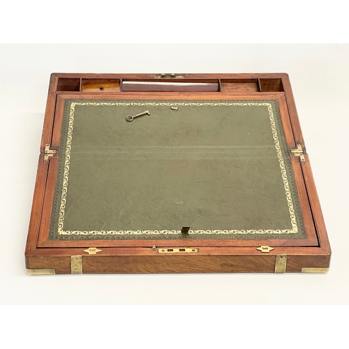 33 - A good quality Victorian mahogany brass bound writing slope with key. Open 50x53cm. Closed 50x26x17c... 