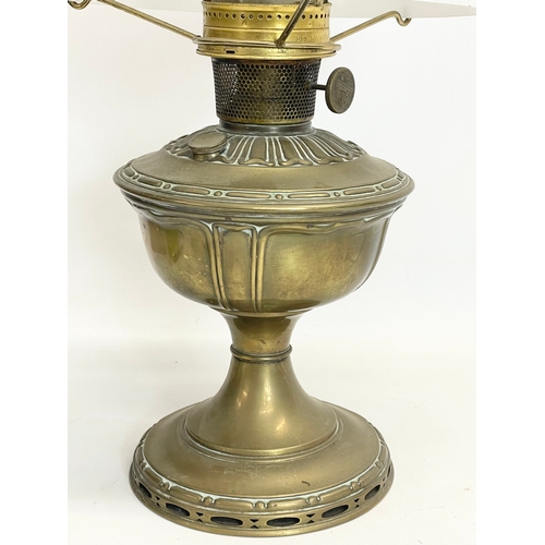 30 - An early 20th century Aladdin Model 9 brass oil lamp with glass shade. 54cm