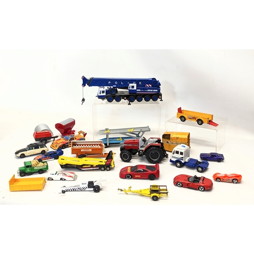 227 - A collection of model cars and trucks, including Corgi, Matchbox, Hotwheels, etc.