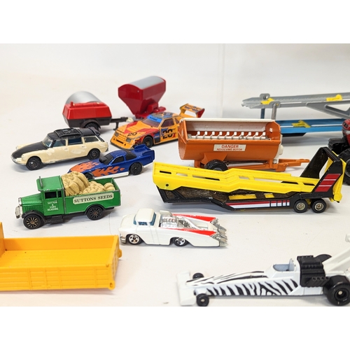 227 - A collection of model cars and trucks, including Corgi, Matchbox, Hotwheels, etc.