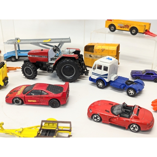 227 - A collection of model cars and trucks, including Corgi, Matchbox, Hotwheels, etc.