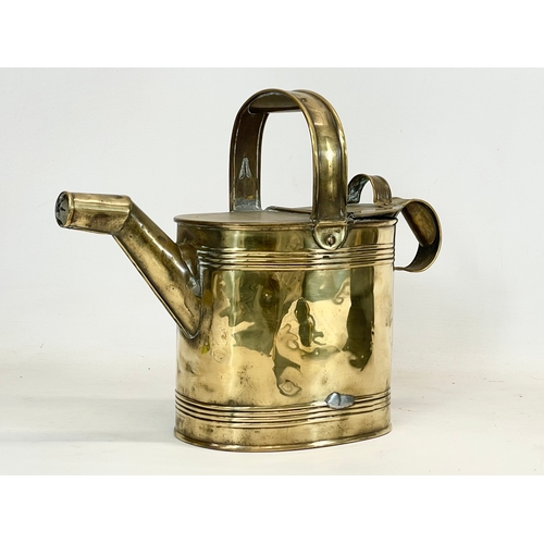 332 - A late Victorian R. Perry Son & Co small brass watering can. Circa 1900. 33x13x27cm