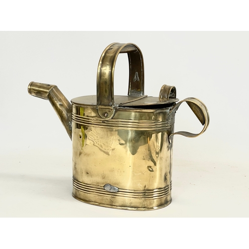 332 - A late Victorian R. Perry Son & Co small brass watering can. Circa 1900. 33x13x27cm