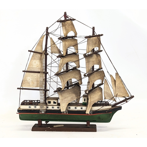 138 - 2 early 20th century wooden model ships. Largest measures 45x44.5cm