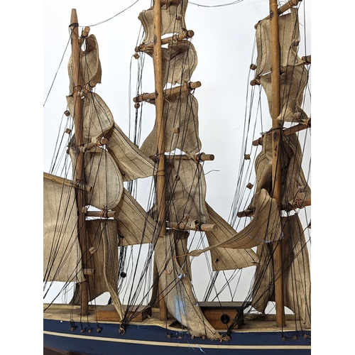 138 - 2 early 20th century wooden model ships. Largest measures 45x44.5cm