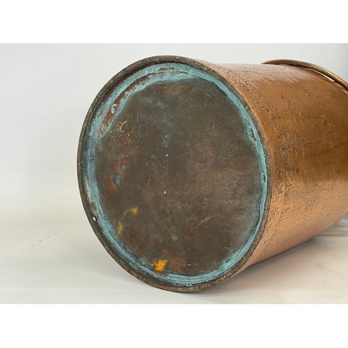 336 - An early 20th century copper milk churn. 47cm not including handle.