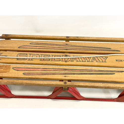 86 - A vintage Speedway wood and metal sled. 143cm