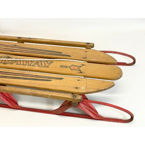 86 - A vintage Speedway wood and metal sled. 143cm