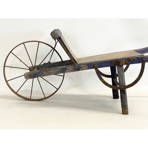 339 - A small early 20th century wooden barrow. 109x38.5x39.5cm