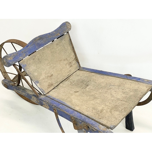 339 - A small early 20th century wooden barrow. 109x38.5x39.5cm