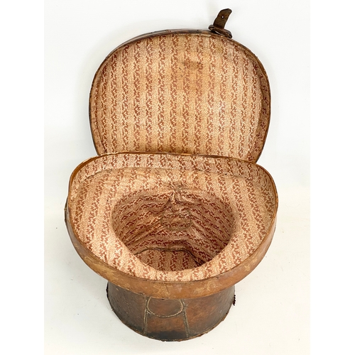 277 - A Victorian leather hat box. 35x34x26cm