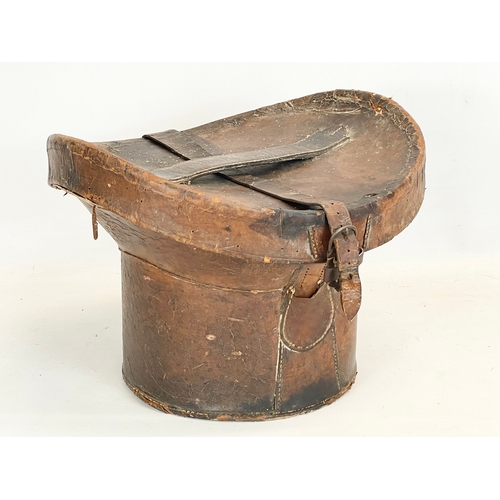 277 - A Victorian leather hat box. 35x34x26cm