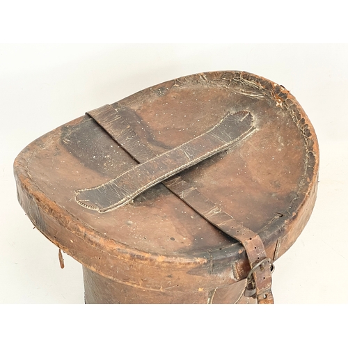 277 - A Victorian leather hat box. 35x34x26cm