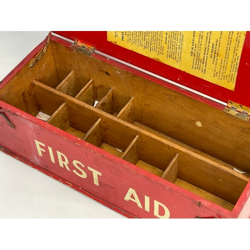 341 - A vintage wooden First Aid box. 54x22x18cm