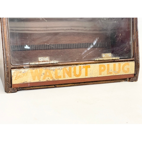 142 - A vintage shops cigar display cabinet, with enamel Smoke Walnut Plug advertising. 29x31x21cm