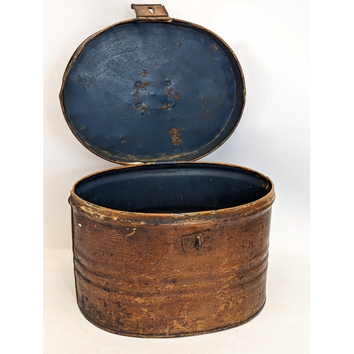 342 - A Victorian metal hat box. 32x23cm