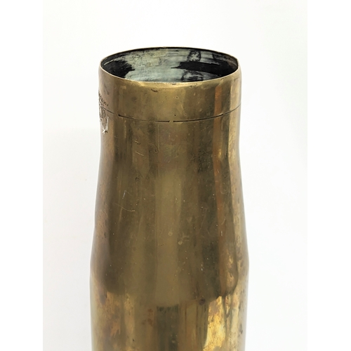 296 - A large brass canon shell. 69.5cm