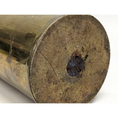 296 - A large brass canon shell. 69.5cm