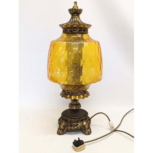 295 - A large ornate vintage amber glass and brass paraffin lamp. 62cm