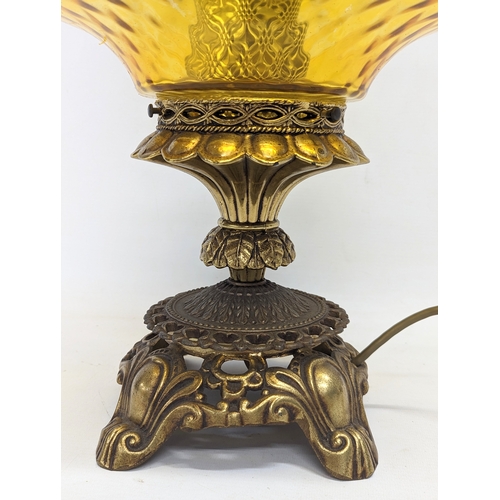 295 - A large ornate vintage amber glass and brass paraffin lamp. 62cm