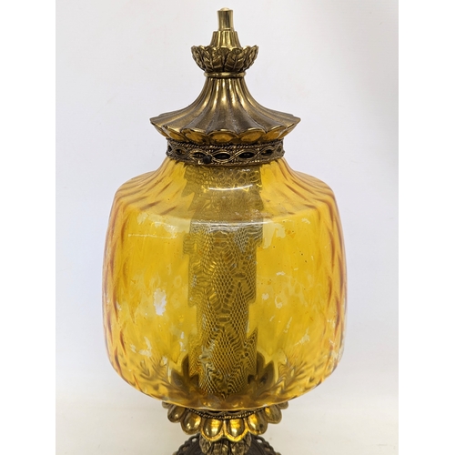 295 - A large ornate vintage amber glass and brass paraffin lamp. 62cm