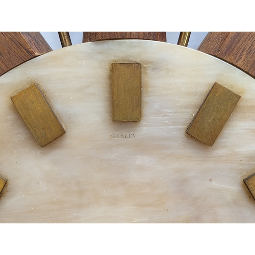 150 - A Mid Century teak sunburst clock, no works. 60cm