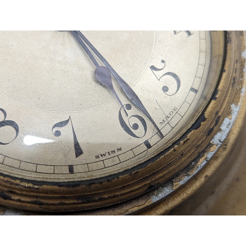 152 - A 1930s brass sunburst wall clock.  40cm