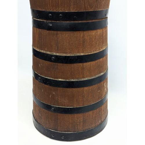 153 - A large early 20th century oak butter churn. 127cm