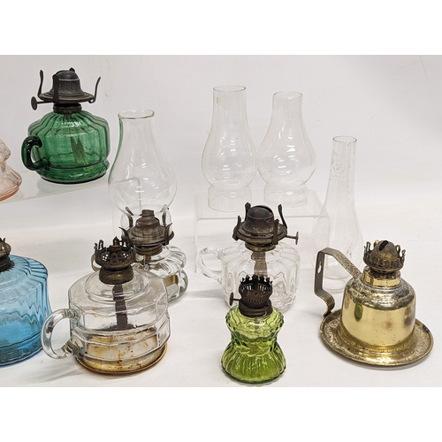 185 - A quantity of Victorian finger oil lamps.